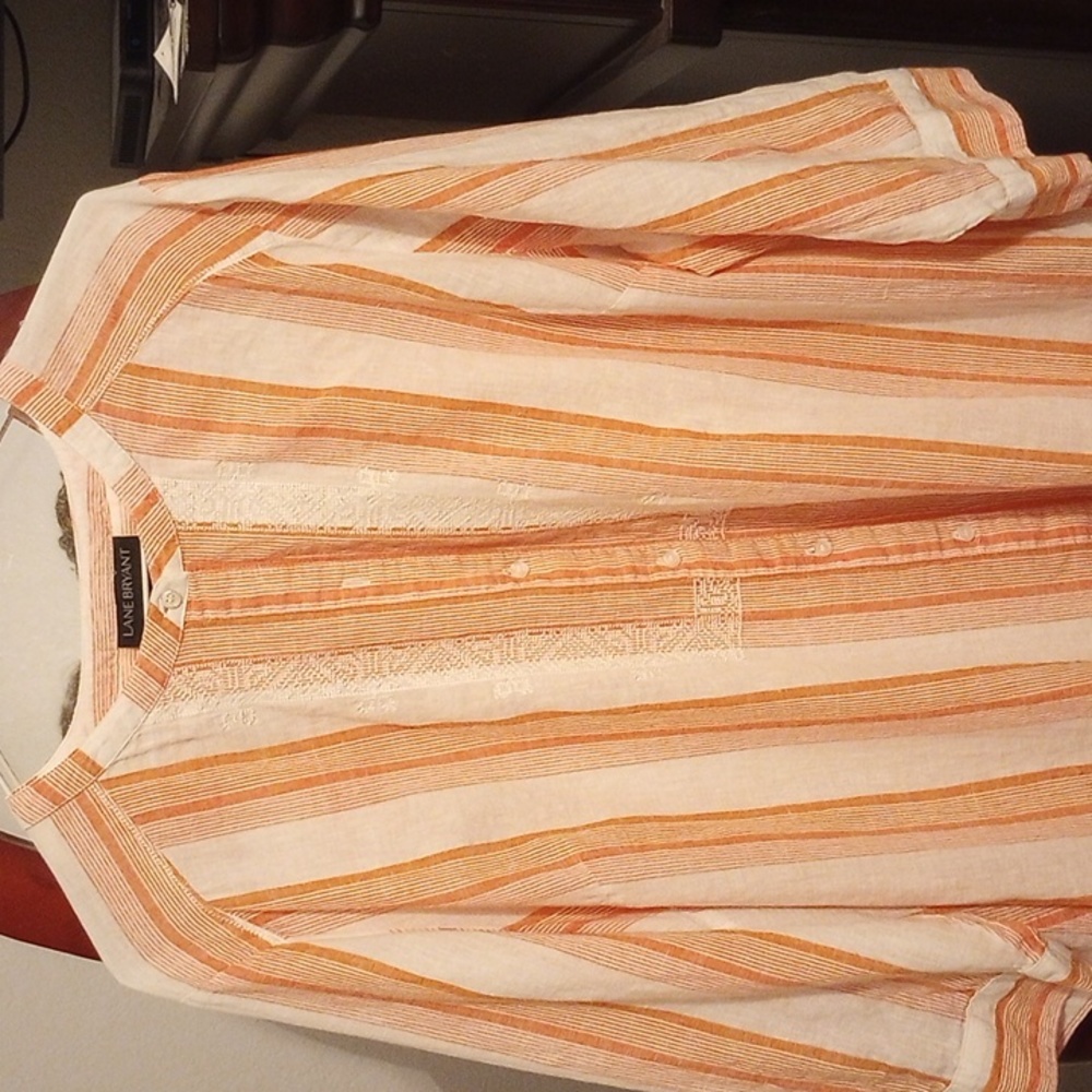 A coral button up blouse guys it's not orange